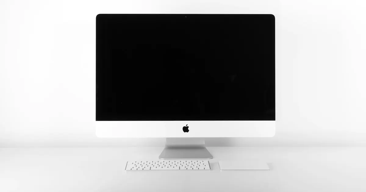 Silver iMac on a clean white desk — iMac repair in Guwahati