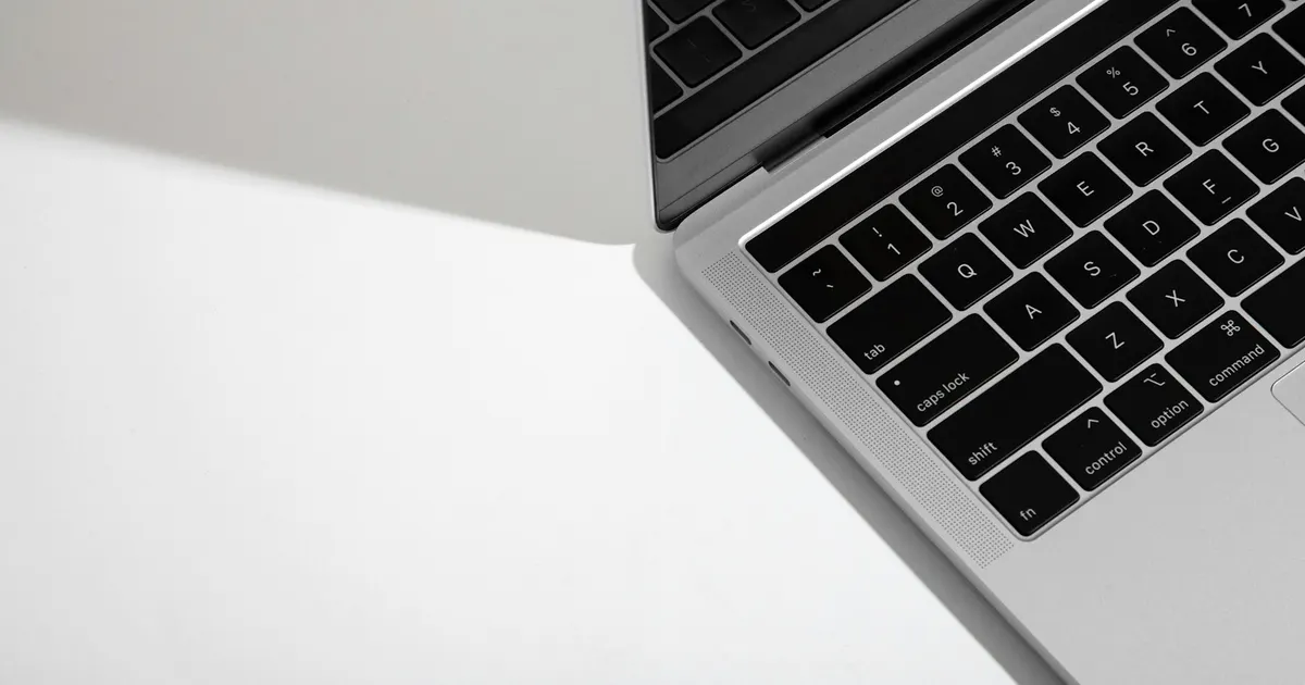 Silver MacBook Air on a clean white desk