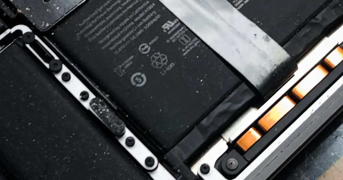 Inside of a laptop showing its battery cells