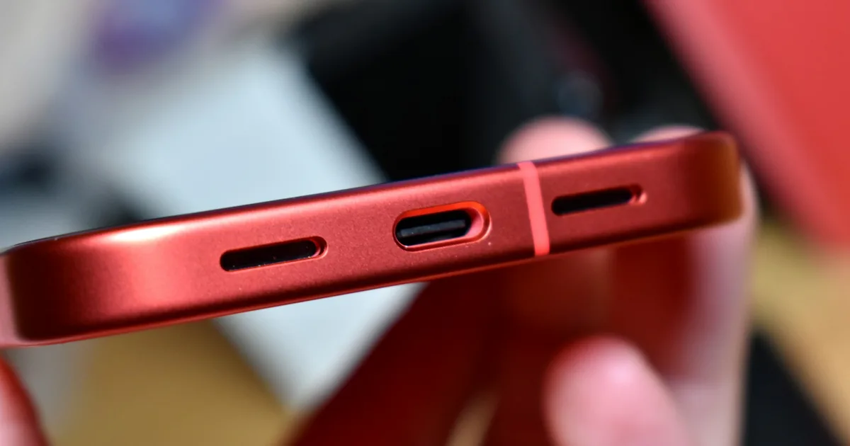 Close-up of a phone USB-C charging port and speaker grilles