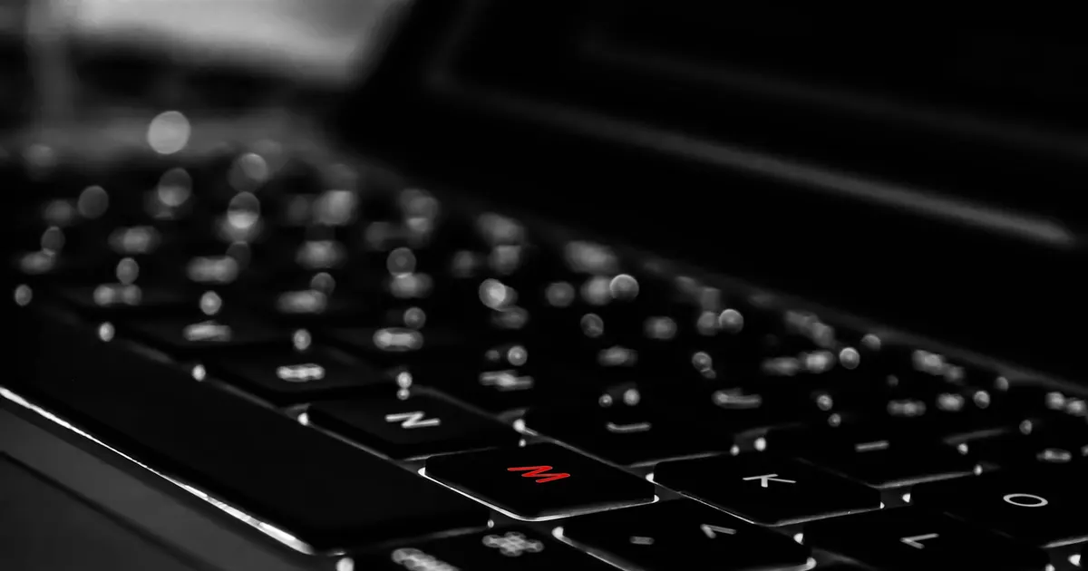 Close-up of a dark MacBook keyboard
